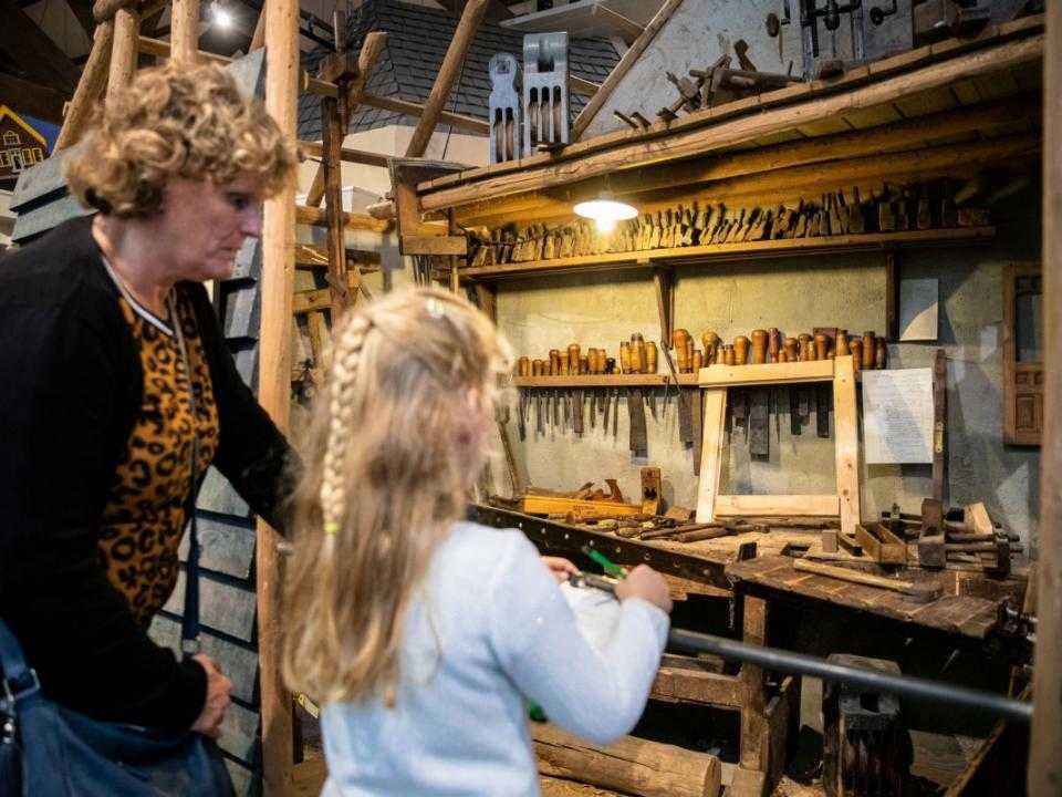 Girl looks at shop from early