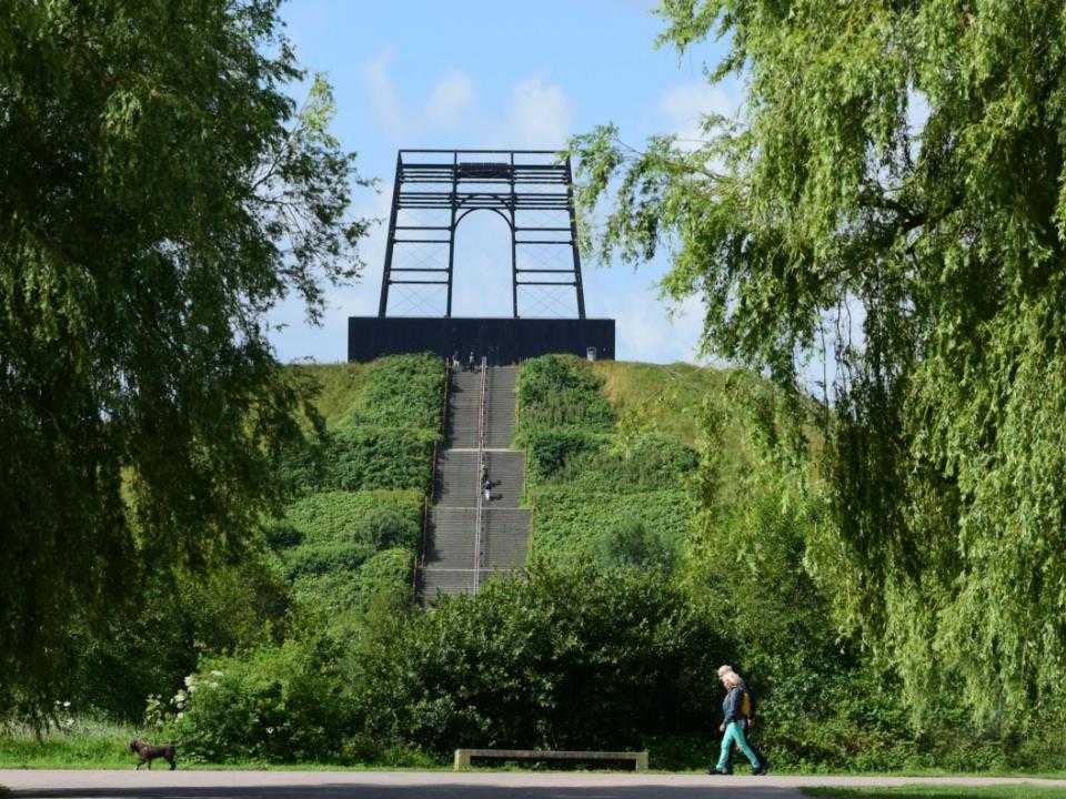 Artwork seen from below of Big Spotters Hill with stairs going up