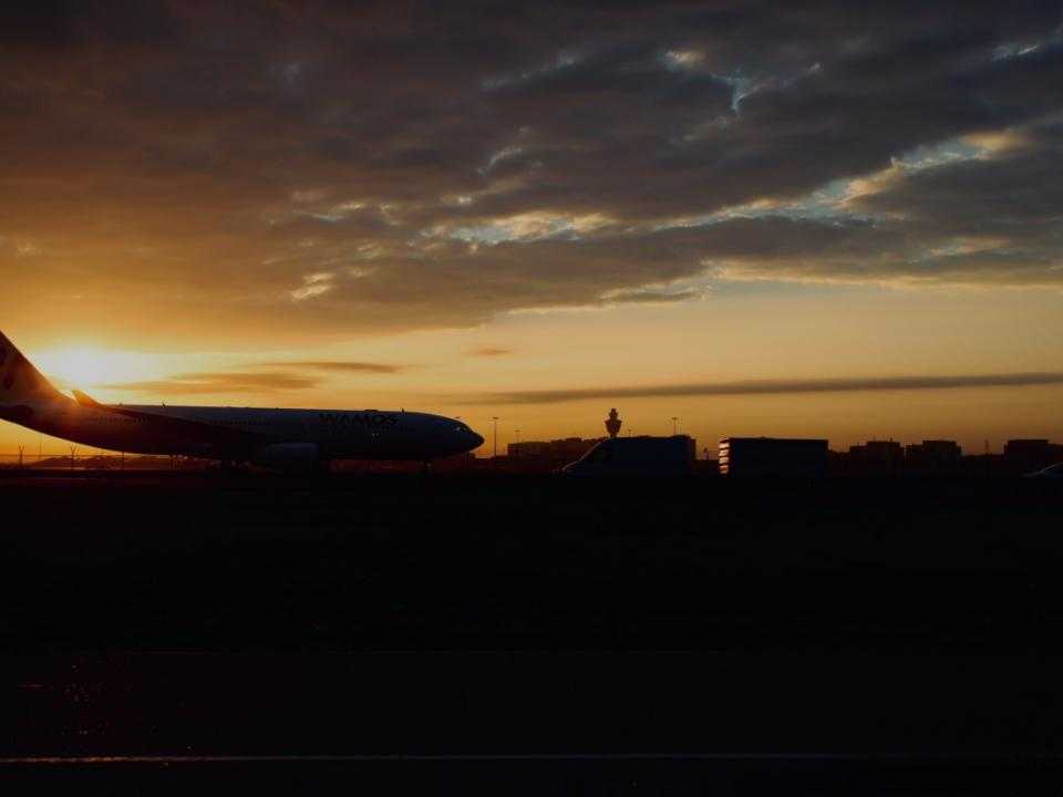 Airplane at Schiphol in the sunset