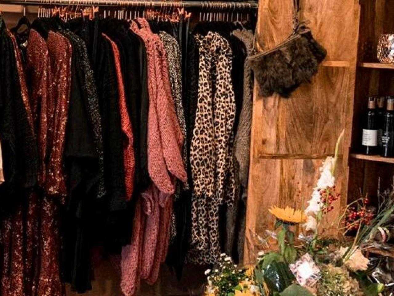 Shop rack with clothes and cupboard with nice things