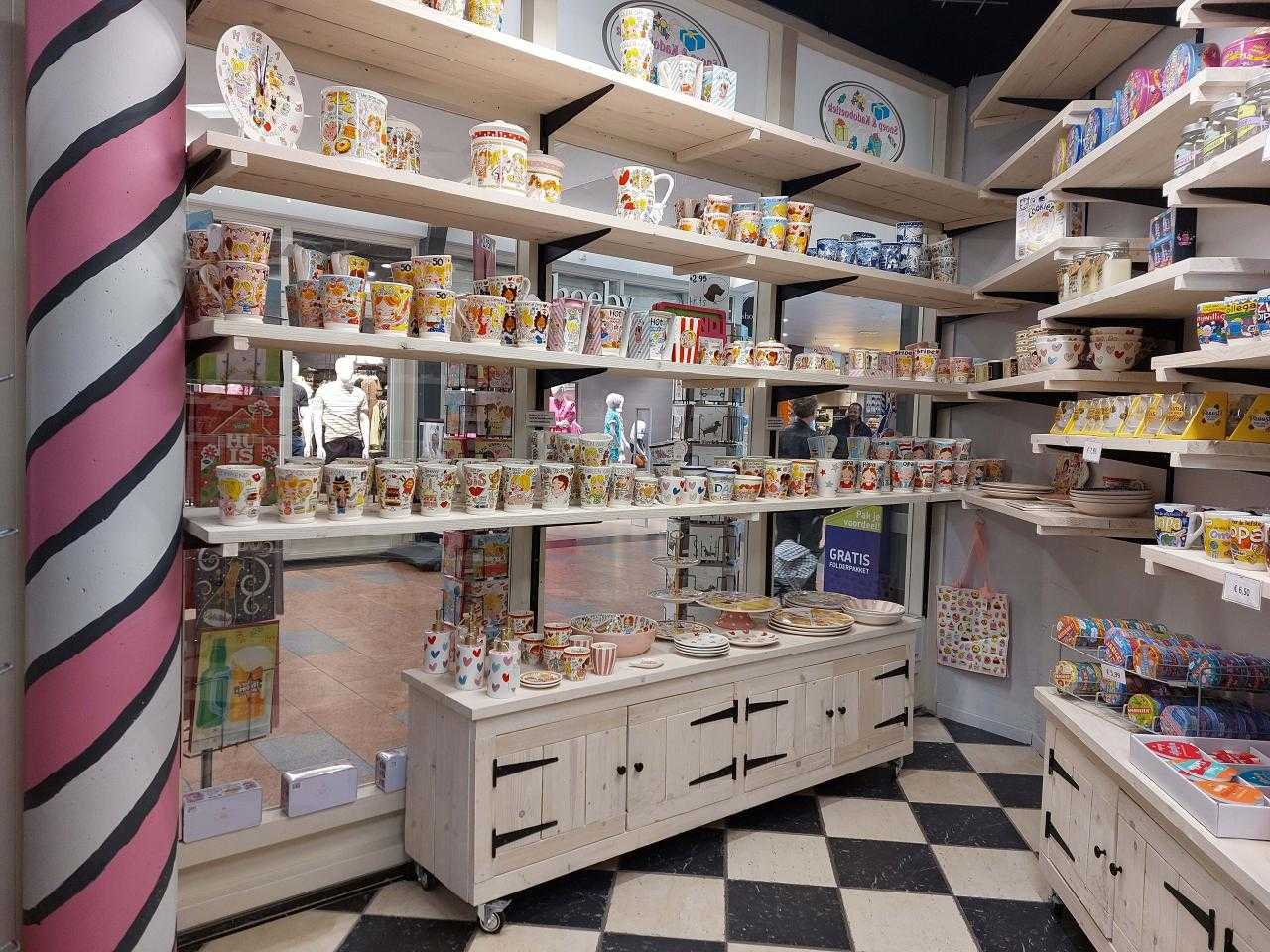 Candy shop with checkered floor and lots of mugs