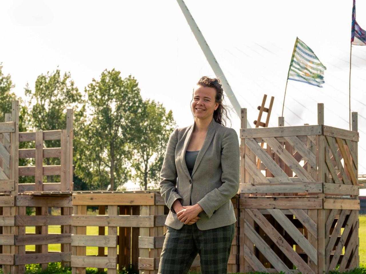 Nathalie stands in front of blocks with Calatrava Bridge in the background