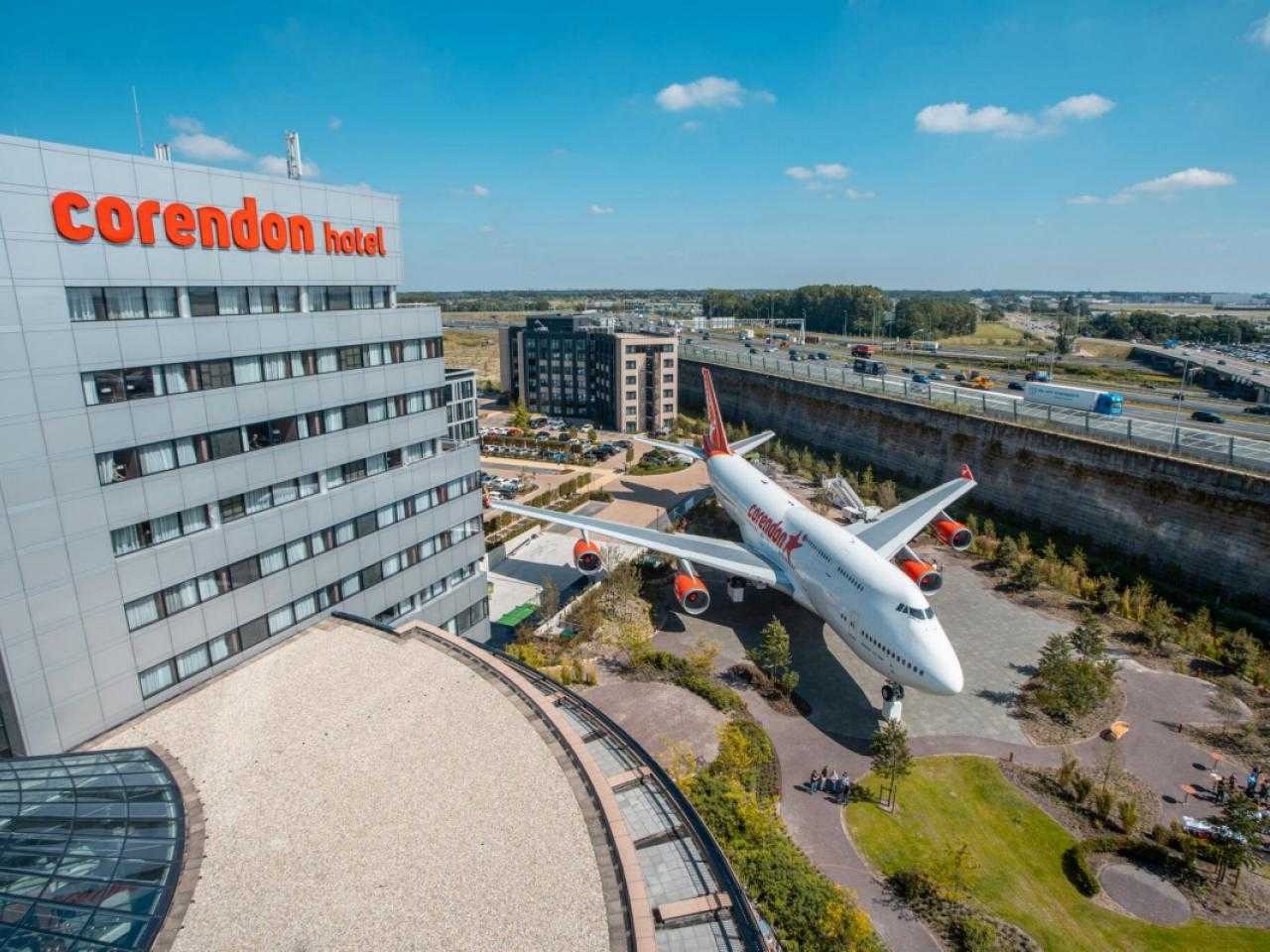 View of hotel Corendon with airplane next to it