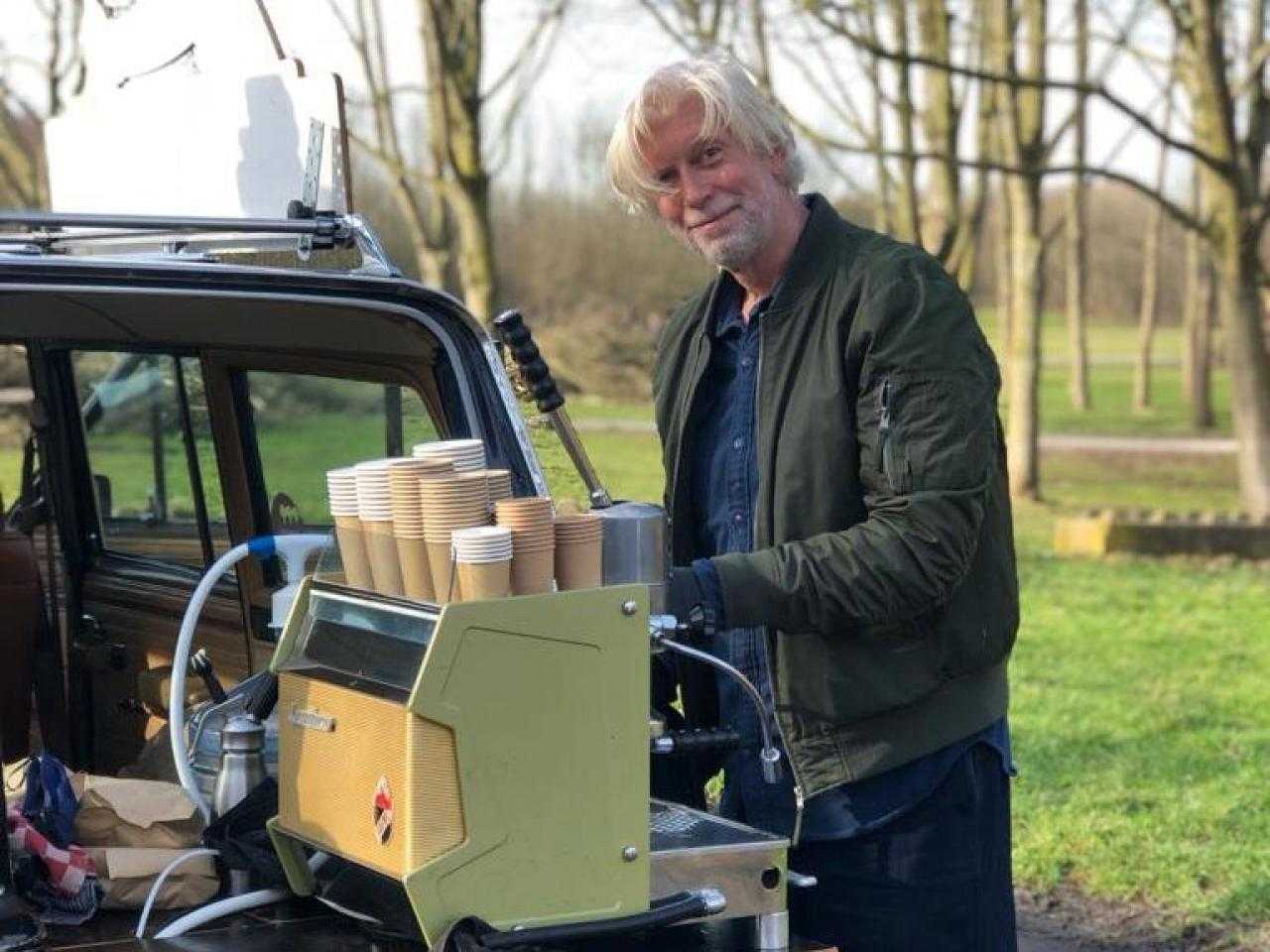 Erik makes coffee in his Jeep